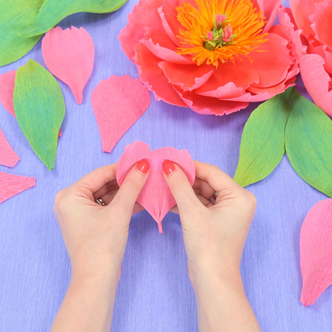 Shaping large pink crepe paper petals